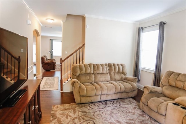 6892 Big Sky Dr, Flowery Branch, GA 30542 - living area featuring wood finished floors, stairway, crown molding, arched walkways, and baseboards