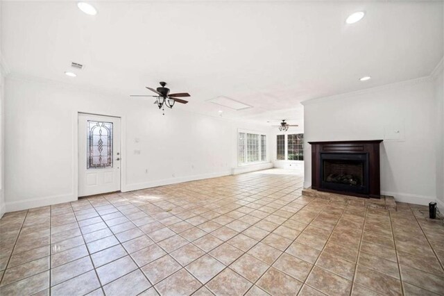 unfurnished living room featuring ceiling fan, ornamental molding, and light tile patterned floors