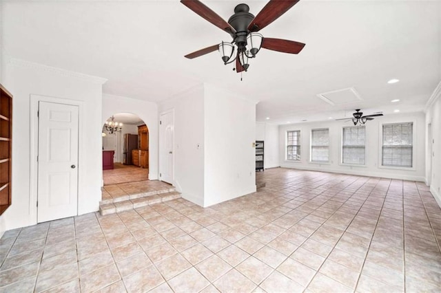 unfurnished living room with light tile patterned floors, ceiling fan with notable chandelier, and ornamental molding