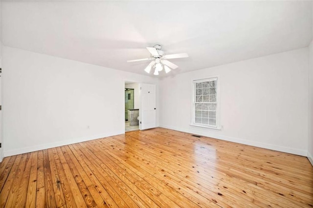 empty room featuring ceiling fan and light wood-type flooring