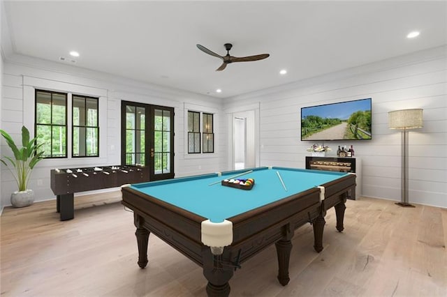 rec room with ceiling fan, light hardwood / wood-style floors, billiards, and french doors