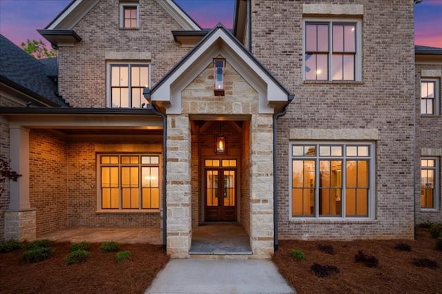 exterior entry at dusk with french doors