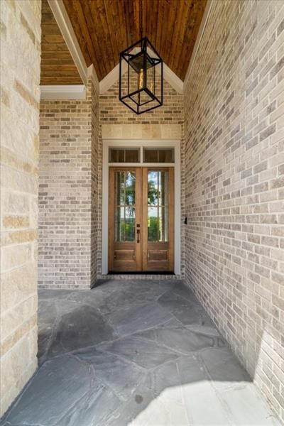 view of exterior entry featuring french doors