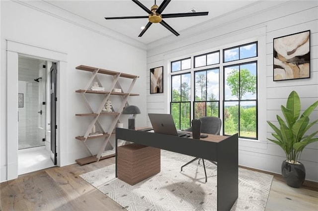 office featuring light wood-type flooring and ceiling fan