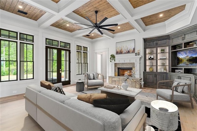 living room with beam ceiling, french doors, wood ceiling, and coffered ceiling