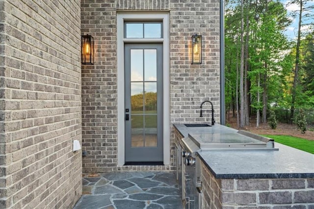 entrance to property with sink and exterior kitchen