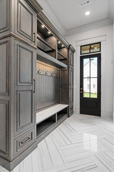 mudroom with ornamental molding