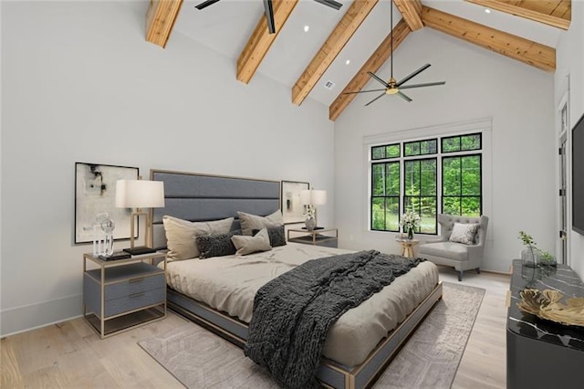 bedroom with beam ceiling, light hardwood / wood-style flooring, high vaulted ceiling, and ceiling fan