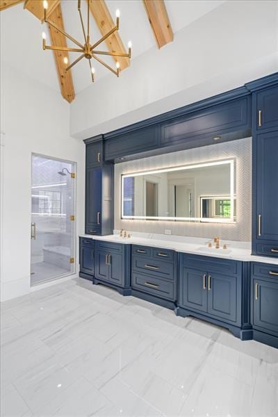 bathroom with beamed ceiling, vanity, high vaulted ceiling, and walk in shower