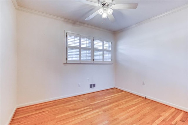 empty room featuring ceiling fan, light hardwood / wood-style floors, and ornamental molding