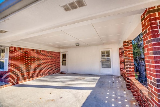 property entrance featuring a carport