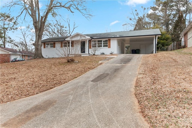 single story home with a carport