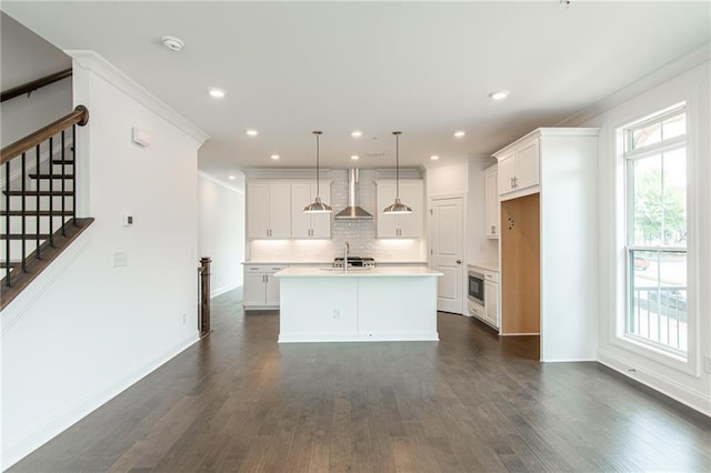 348 Olmstead Way Unit 30, Alpharetta, GA 30022 - kitchen featuring wall chimney exhaust hood, a sink, plenty of natural light, decorative backsplash, and recessed lighting