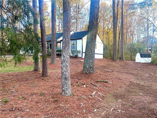 exterior space featuring a storage unit