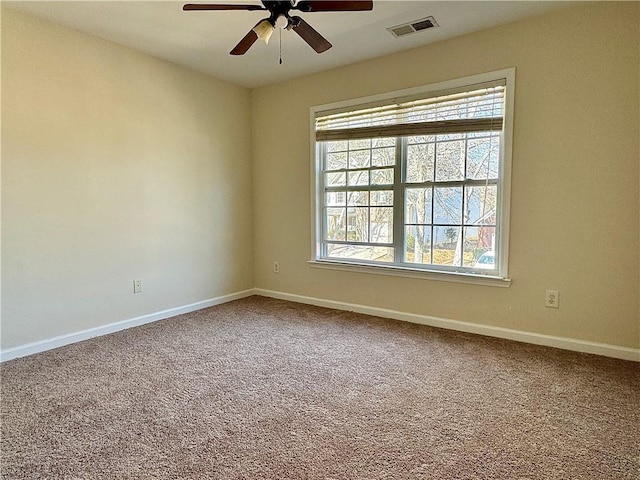 unfurnished room with carpet floors and ceiling fan