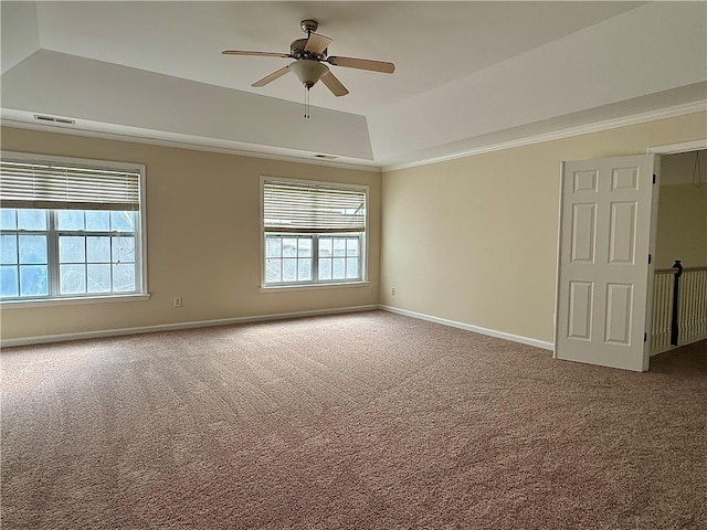 unfurnished room with crown molding, carpet floors, ceiling fan, and a tray ceiling