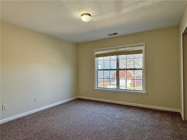 tiled living room with ceiling fan and ornate columns