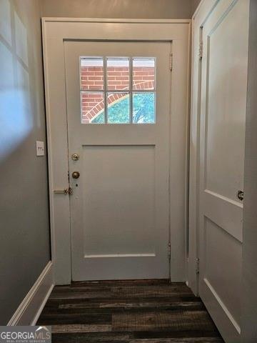 doorway to outside featuring dark hardwood / wood-style flooring