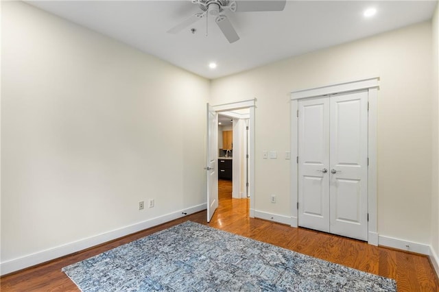 bedroom featuring ceiling fan, baseboards, wood finished floors, and recessed lighting