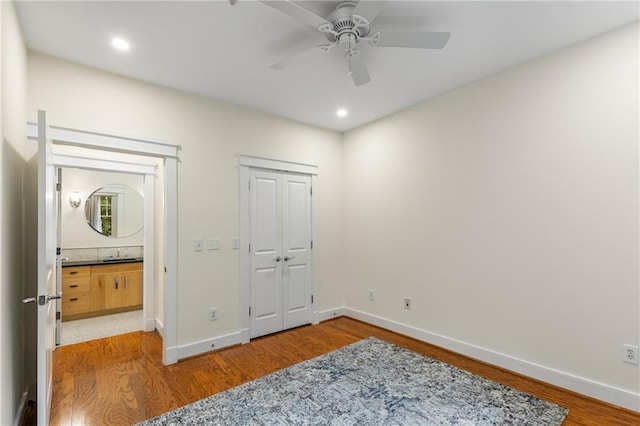 bedroom with recessed lighting, baseboards, wood finished floors, and a ceiling fan