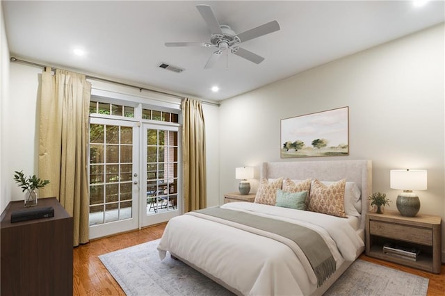 bedroom with wood finished floors, visible vents, ceiling fan, french doors, and access to outside