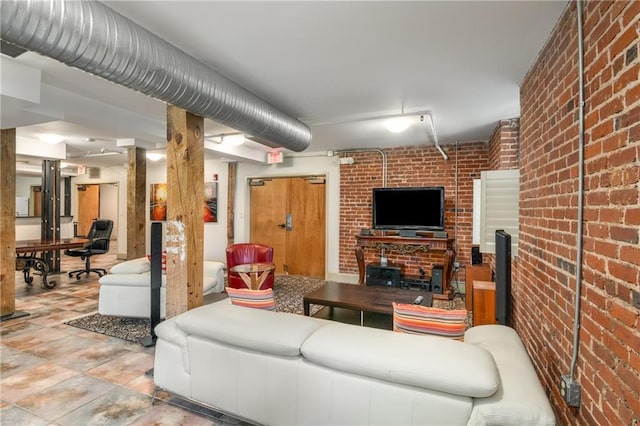 living area with brick wall