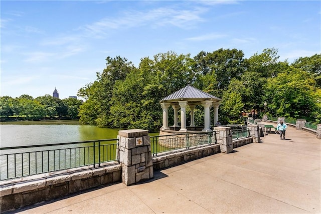 view of patio / terrace featuring a gazebo and a water view