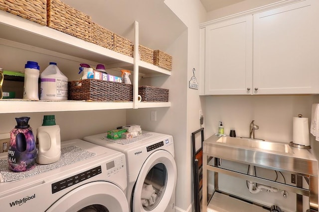 laundry room with cabinet space and washer and dryer