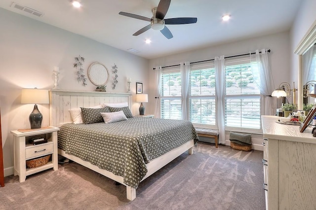 bedroom with carpet, visible vents, and a ceiling fan