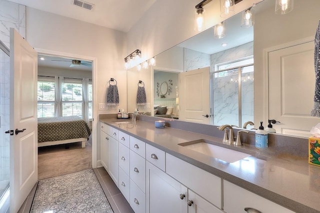 full bath with a sink, plenty of natural light, ensuite bath, and visible vents