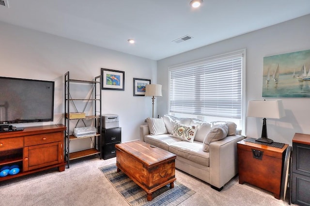 living room featuring recessed lighting, visible vents, and light colored carpet