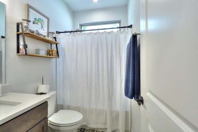 full bath featuring vanity and toilet