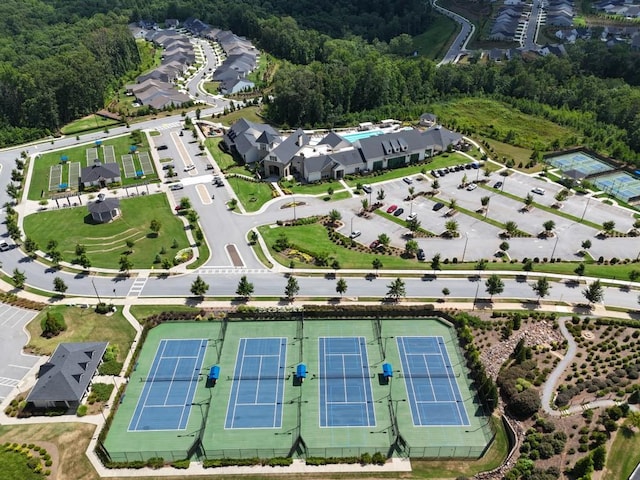 birds eye view of property with a forest view