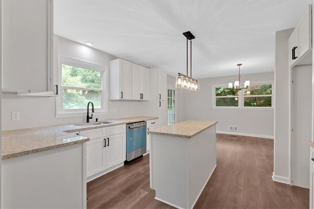 4477 Timber Ridge Dr, Douglasville, GA 30135 - kitchen featuring dishwasher, a chandelier, a kitchen island, and dark wood finished floors
