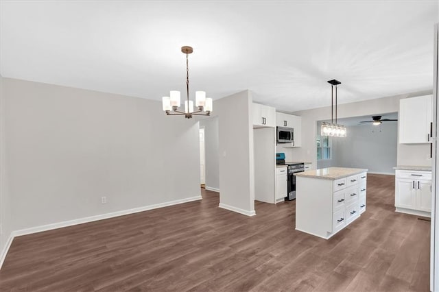 4477 Timber Ridge Dr, Douglasville, GA 30135 - kitchen with stainless steel appliances, a chandelier, ceiling fan, a kitchen island, and white cabinets