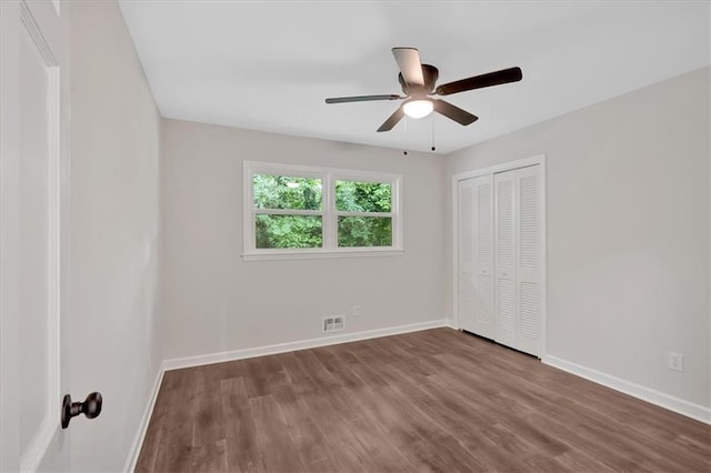 4477 Timber Ridge Dr, Douglasville, GA 30135 - unfurnished bedroom featuring wood finished floors, a closet, and ceiling fan