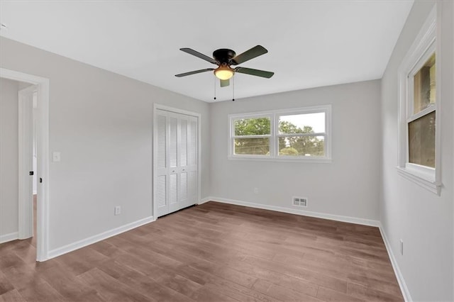 4477 Timber Ridge Dr, Douglasville, GA 30135 - unfurnished bedroom with wood finished floors, a closet, and ceiling fan