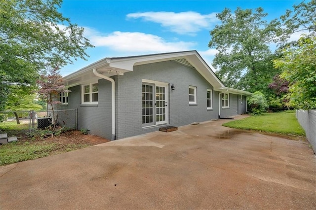 4477 Timber Ridge Dr, Douglasville, GA 30135 - back of house featuring brick siding and a patio area