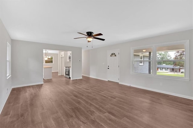 4477 Timber Ridge Dr, Douglasville, GA 30135 - unfurnished living room with dark wood-style flooring and ceiling fan