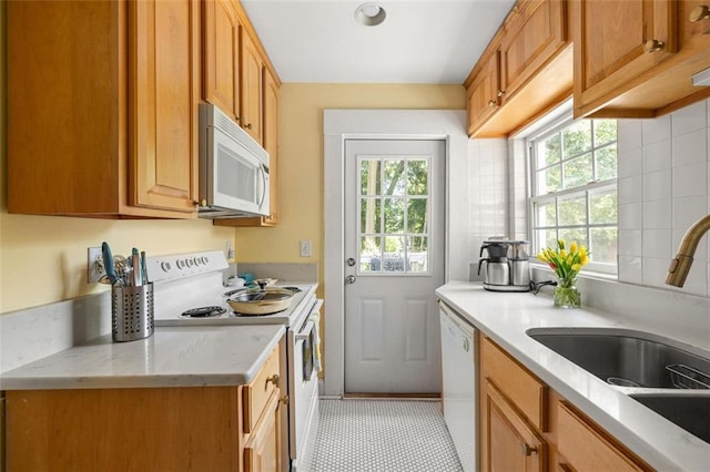 737 Barnett St NE Unit B6, Atlanta, GA 30306 - kitchen with white appliances, light tile patterned floors, and light stone counters