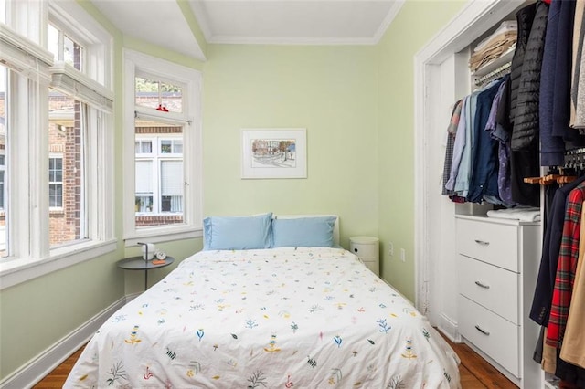 737 Barnett St NE Unit B6, Atlanta, GA 30306 - bedroom with dark wood-style flooring, multiple windows, and ornamental molding