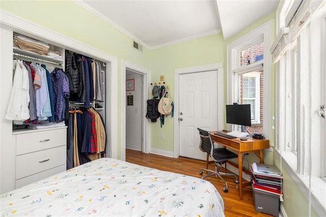 737 Barnett St NE Unit B6, Atlanta, GA 30306 - bedroom featuring ornamental molding, wood finished floors, and a closet