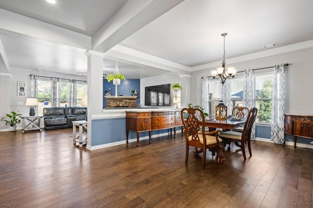 dining space featuring a chandelier, dark hardwood / wood-style floors, and ornamental molding