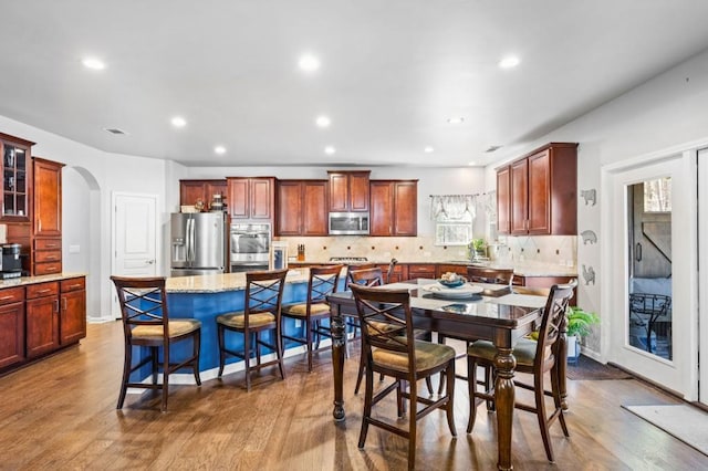 dining space featuring hardwood / wood-style flooring