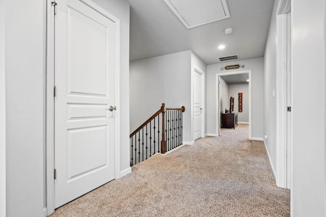 hallway with light carpet