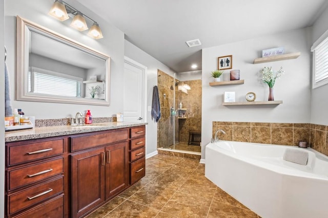 bathroom with shower with separate bathtub, tile patterned flooring, and vanity