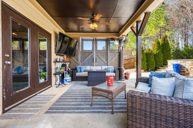 view of patio / terrace with french doors, ceiling fan, and an outdoor hangout area