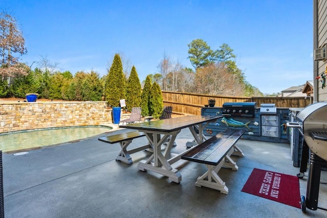 view of patio / terrace featuring area for grilling and a fenced in pool