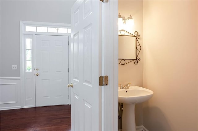 bathroom with hardwood / wood-style flooring