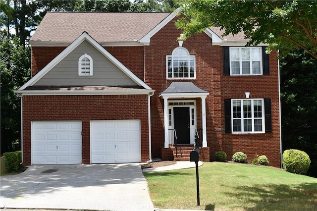 view of front of property featuring a front lawn and a garage